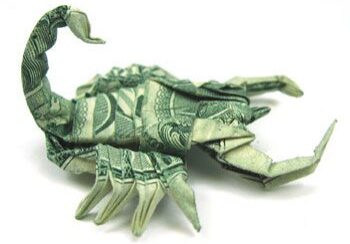 Dollar bill folded into scorpion shape