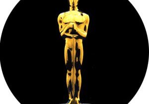 Golden award statue on black background
