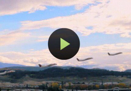 Airplanes flying over scenic landscape