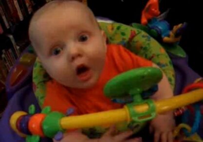 Baby in colorful activity center