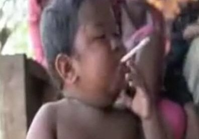 Boy holding a cigarette