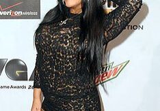 Woman in leopard print dress posing