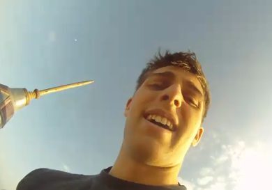 Man smiling with a clear sky background