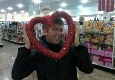 Man posing with heart decoration