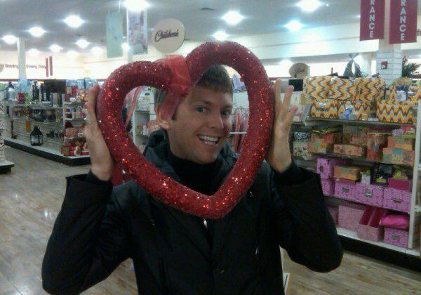 Smiling man with heart-shaped frame