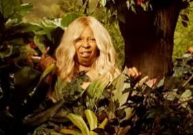 Woman surrounded by dense foliage