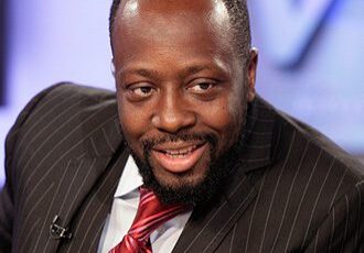 Man in a suit smiling